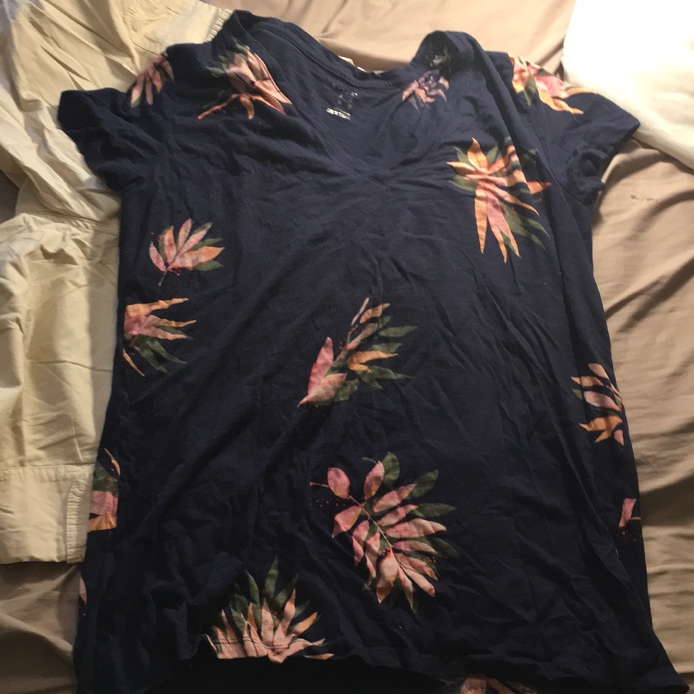 A brand new navy blue shirt with flowers